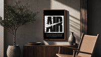 Nike Air logo with swoosh poster framed above a fluted sideboard beside an olive tree