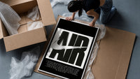 Nike Air logo with swoosh framed print being unpacked from protective bubble wrap and a box