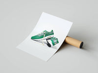 Emerald green Nike Air Max 1 pair shown at a dynamic angle unrolled beside a shipping tube