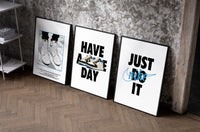 Nike "Have a Nice Day" Sneaker Poster Set of 3 as black-framed prints leaning against a raw-plaster wall