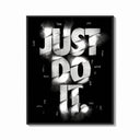 Framed Just Do It typography design print shown as a bold statement piece on a clean gallery wall