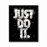 Framed Just Do It typography design print shown as a bold statement piece on a clean gallery wall