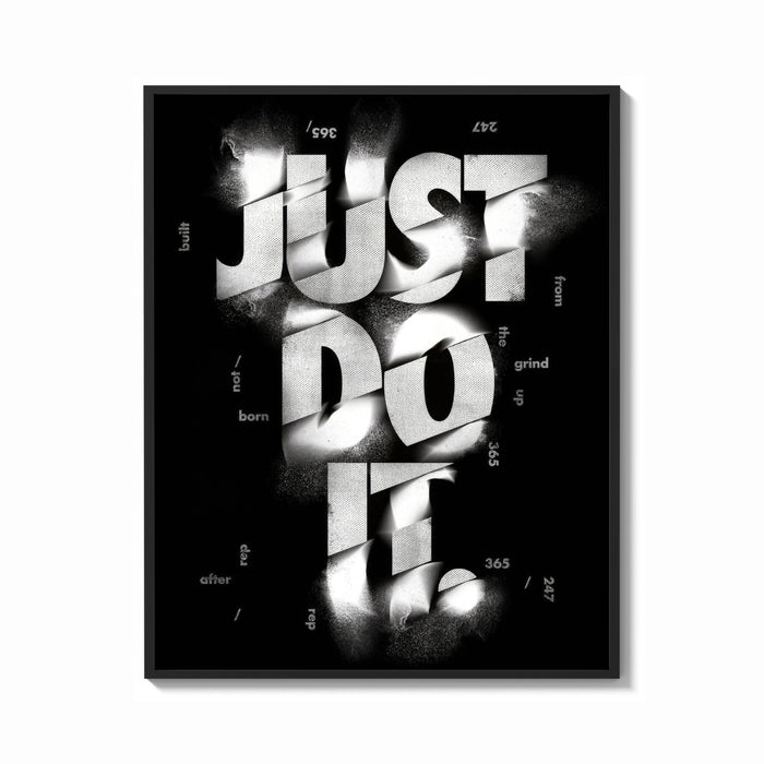 Framed Just Do It typography design print shown as a bold statement piece on a clean gallery wall