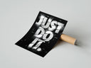 Rolled Just Do It typography design poster beside its crush-resistant kraft shipping tube