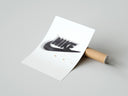 Rolled Blurred Nike swoosh logo poster beside its crush-resistant kraft shipping tube