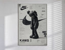 KAWS Companion figure standing poster in a slim frame on a bright wall with soft window light
