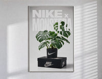 Monstera plant in Nike pot poster in a slim frame on a bright wall with soft window light