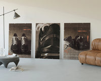 Nike running shoes triptych three-panel set displayed beside a brown leather sofa