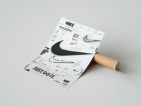 Rolled Nike Swoosh logo design study poster beside its crush-resistant kraft shipping tube