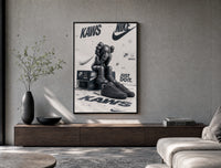 KAWS Companion figure and sneaker poster framed above a wood console in a concrete-wall living room