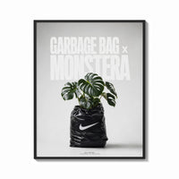 Framed Monstera plant in Nike garbage bag print shown as a bold statement piece on a clean gallery wall