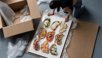 Nine Crostini Grid framed print being unpacked from protective bubble wrap and a box