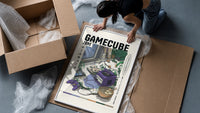 Purple GameCube console with controller framed print being unpacked from protective bubble wrap and a box