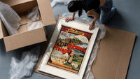 French coastal travel scenes framed print being unpacked from protective bubble wrap and a box