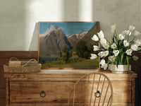 Norwegian fjord mountain landscape with cabin print in an oak frame on a farmhouse dresser beside white tulips