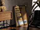 Walnut-framed Motivational typography shoe box label print leaning against a sunlit rustic brick wall
