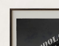 Close-up of the advertising blimp airship print's dark wood frame corner and archival matte paper