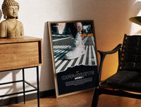 Brass-framed White Nike Air Force 1 sneaker print leaning in a warm styled corner by a sculpture