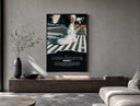 White Nike Air Force 1 sneaker poster framed above a wood console in a concrete-wall living room