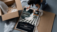 White Nike Air Force 1 sneaker framed print being unpacked from protective bubble wrap and a box