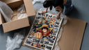 One Piece Straw Hat Crew characters framed print being unpacked from protective bubble wrap and a box