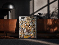 Black-framed Usopp sniper character collage print on a moody console with designer coffee-table books