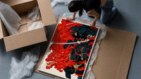 Demon-masked samurai riding black horse framed print being unpacked from protective bubble wrap and a box