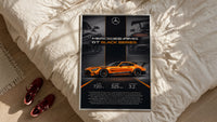 Orange Mercedes-AMG GT Black Series framed print styled on a bed with sneakers alongside