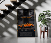 Orange Mercedes-AMG GT Black Series framed print on a staircase entryway wall beside a plant