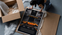Orange Mercedes-AMG GT Black Series framed print being unboxed from protective packaging