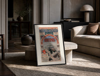 Orient Express railway travel poster print in a black frame leaning on a travertine table in a sunlit lounge