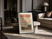 French Auvergne railway travel advertisement print in a black frame leaning on a travertine table in a sunlit lounge