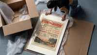 French Auvergne railway travel advertisement framed print being unpacked from protective bubble wrap and a box