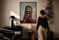 Ornate Headpiece with Fringe and Rings print in a black frame on a sunlit wall with a viewer