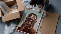 Ornate Headpiece with Fringe and Rings framed print being unpacked from protective bubble wrap and a box