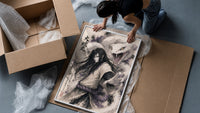 Long-haired man with giant white snake framed print being unpacked from protective bubble wrap and a box