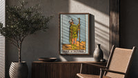Page of Wands poster framed above a fluted sideboard beside a potted tree