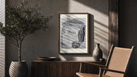 Reclining Egyptian woman perfume advertisement poster framed above a fluted sideboard beside an olive tree
