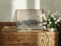 River bridge with city skyline print in an oak frame on a farmhouse dresser beside white tulips