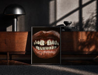 Black-framed Parted Lips with Gold-Tone Grillz print on the floor in front of a dark wooden console