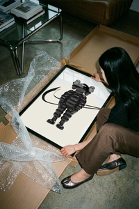 The Black inflated cartoon companion figure poster shown across its range of print sizes