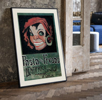 Grinning woman's face with earring print in a black frame leaning beside a vintage door on parquet