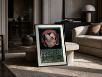 Grinning woman's face with earring print in a black frame leaning on a travertine table in a sunlit lounge