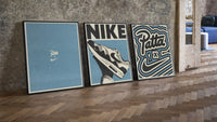 Patta x Nike Air Max 1 Blue Triptych leaning on parquet beside a vintage loft door