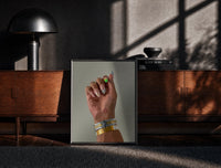 Black-framed Patterned Nails with Stacked Watches print on the floor in front of a dark wooden console
