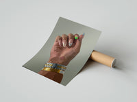 Gently curled Patterned Nails with Stacked Watches print beside its protective shipping tube