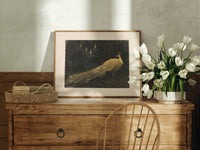 White peacock in landscape print in an oak frame on a farmhouse dresser beside white tulips