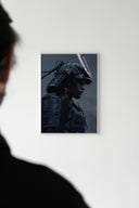 Person viewing a framed midnight ronin samurai poster on a white gallery wall