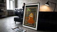 Girl in red dress eating biscuit print in a slim black frame leaning on a dark sofa in a concrete print studio