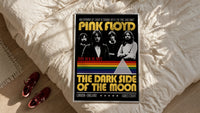 Pink Floyd Dark Side of the Moon Earls Court 1973 framed print styled on a bed with sneakers alongside